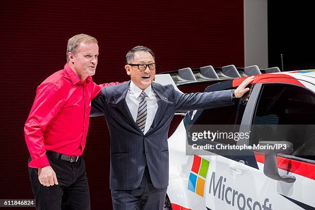 The Finnish rally driver Tommi Makinen poses next to President and CEO of Toyota Motor Corporation Akio Toyoda who presents their latest Toyota Yaris...