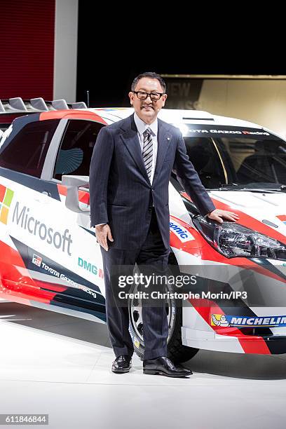 President and CEO of Toyota Motor Corporation Akio Toyoda presents their latest Toyota Yaris car during the press preview of the Paris Motor Show at...