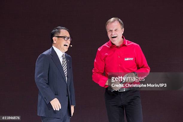 President and CEO of Toyota Motor Corporation Akio Toyoda and the Finnish rally driver Tommi Makinen deliver a speech during the press preview of the...