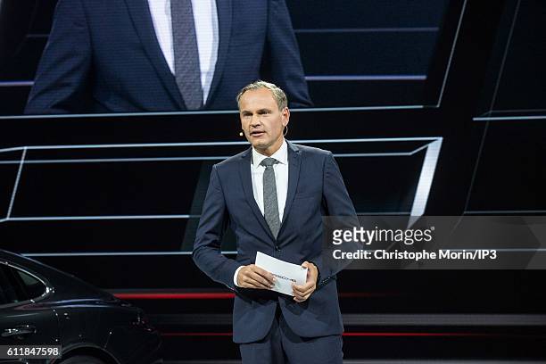 Of Porsche Oliver Blume delivers a speech during the press preview of the Paris Motor Show at Paris Expo Porte de Versailles on September 29, 2016 in...
