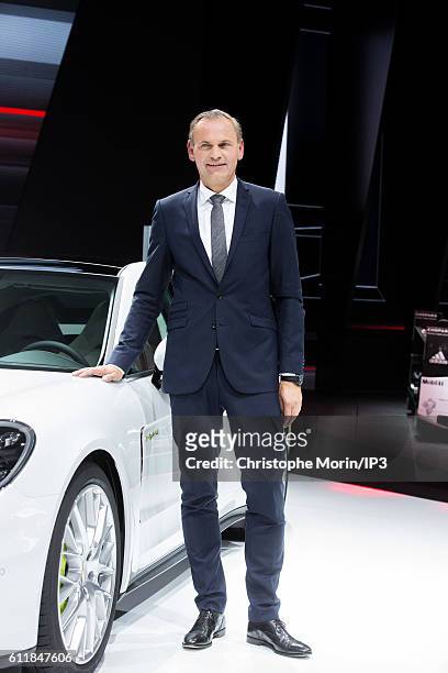 Of Porsche Oliver Blume presents their latest Porsche Panama 4 E Hybrid car during the press preview of the Paris Motor Show at Paris Expo Porte de...