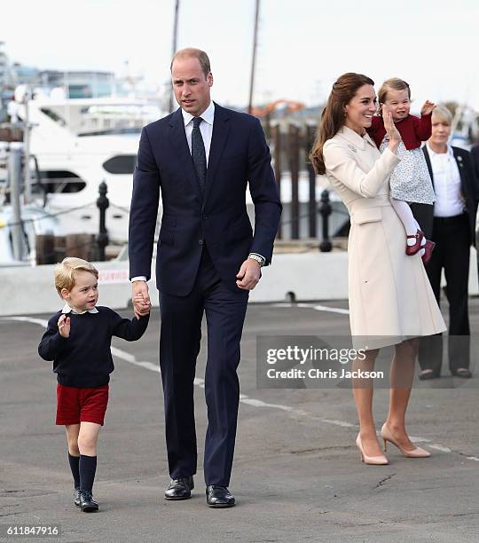 Prince William, Duke of Cambridge, Prince George of Cambridge, Catherine, Duchess of Cambridge and Princess Charlotte wave as they leave from...