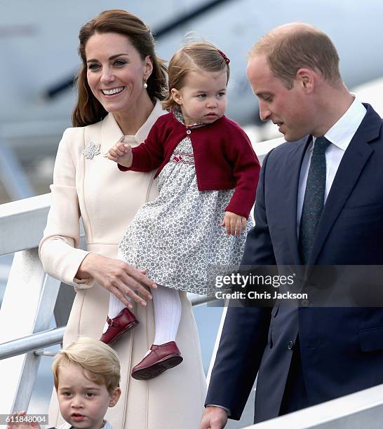 Prince William, Duke of Cambridge, Prince George of Cambridge, Catherine, Duchess of Cambridge and Princess Charlotte wave as they leave from...