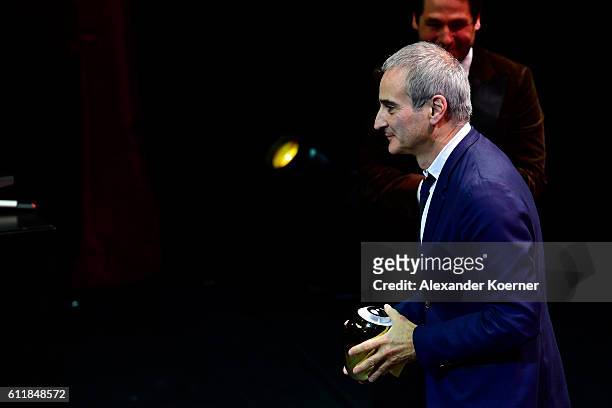 Olivier Assayas gives his acceptance speech after receiving the 'Tribute to...' on stage during the Award Night Ceremony during the 12th Zurich Film...