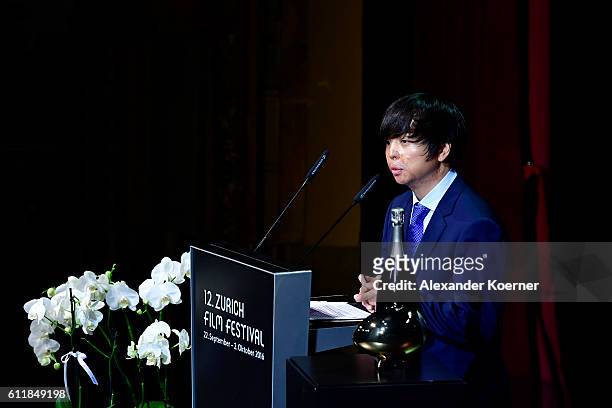 Jero Yun gives his acceptance speech after receiving the award for international documentary for his movie 'Mrs. B., A North Korean Woman' on stage...