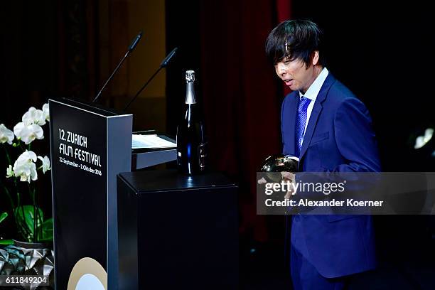 Jero Yun gives his acceptance speech after receiving the award for international documentary for his movie 'Mrs. B., A North Korean Woman' on stage...