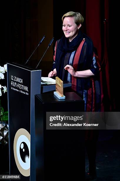 Anna Schwingenschuh gives her acceptance speech after receiving the 'Culture and SRF' award on stage during the Award Night Ceremony during the 12th...