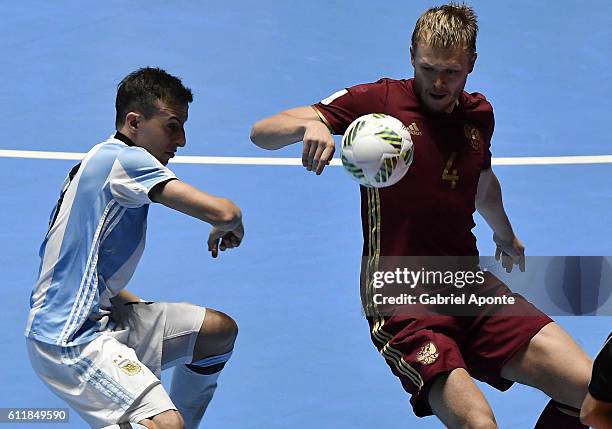 Dmitry Lyskov of Russia struggles for the ball with Maximiliano Rescia of Argentina during the final match between Russia and Argentina as part of...