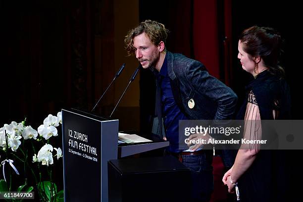 Jan Gassmann gives his acceptance speech after receiving the 'Focus' award for his movie "Europe, She Loves' on stage during the Award Night Ceremony...