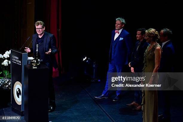 Valentin Hitz gives his acceptance speech after receiving the after receiving the 'Focus' award for his movie 'Stille Reserven' on stage during the...