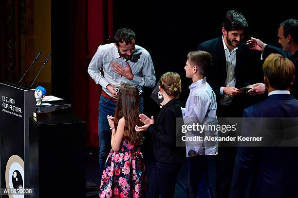 Claude Barras and Max Karli give their acceptance speech after receiving the 'ZFF for Kids' award for their movie 'Ma Vie De Courgette' on stage...