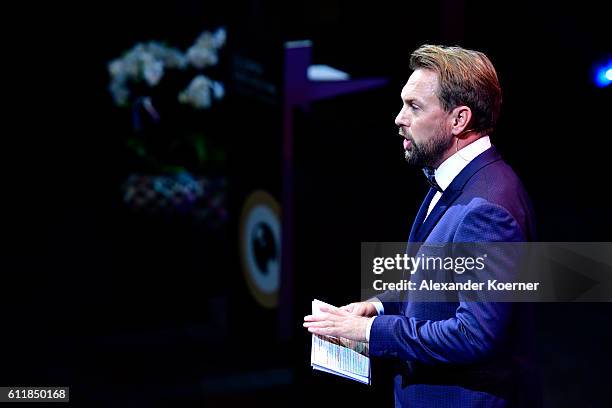 Moderator Steven Gaetjen speaks on stage during the Award Night Ceremony during the 12th Zurich Film Festival on October 1, 2016 in Zurich,...