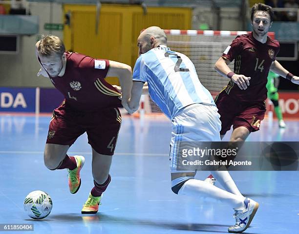 Dmitry Lyskov of Russia struggles for the ball with Damian Stazzone of Argentina during the final match between Russia and Argentina as part of 2016...