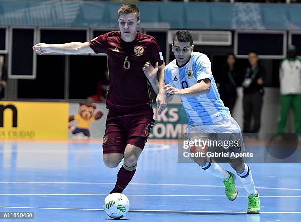 Ivan Chishkala of Russia struggles for the ball with Cristian Borruto of Argentina during the final match between Russia and Argentina as part of...