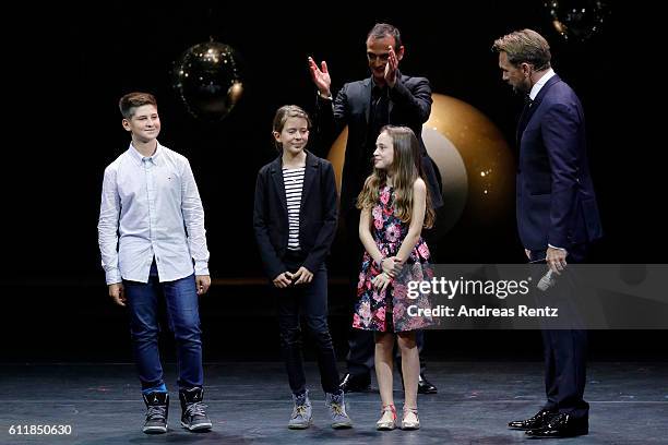 Anatole Taubman, moderator Steven Gaetjen and kids present the 'ZFF for Kids' award on stage during the Award Night Ceremony during the 12th Zurich...