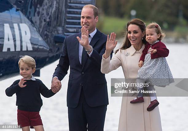 Catherine, Duchess of Cambridge, Prince William, Duke of Cambridge, Prince George of Cambridge and Princess Charlotte of Cambridge wave to...