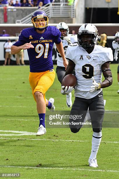 Knights running back Adrian Killins returns a kickoff back for a touchdown in a game between the East Carolina Pirates and the Central Florida...