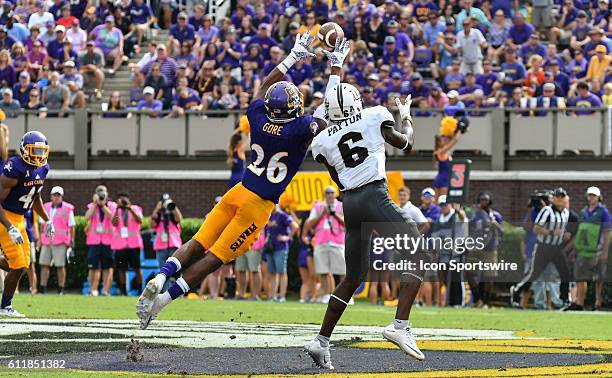 East Carolina Pirates defensive back Colby Gore intercepts a pass intended for UCF Knights wide receiver Tristan Payton in a game between the East...