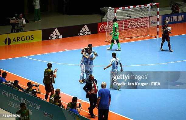 Maximiliano Rescia of Argentina celebrates his goal with team mates during the FIFA Futsal World Cup final between Russia and Argentina at Coliseo el...