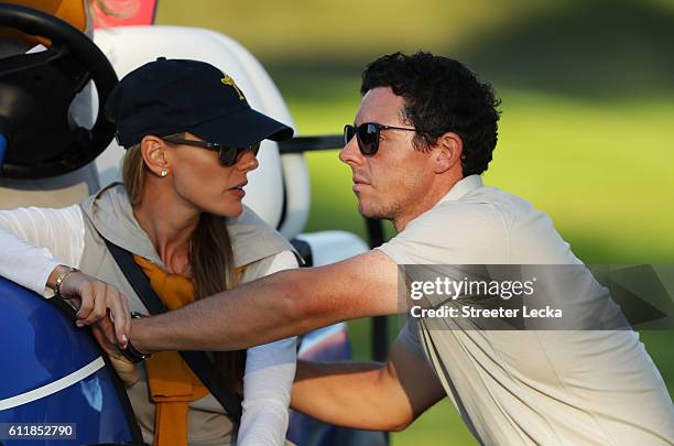 Erica Stoll and Rory McIlroy of Europe look on during afternoon fourball matches of the 2016 Ryder Cup at Hazeltine National Golf Club on October 1,...