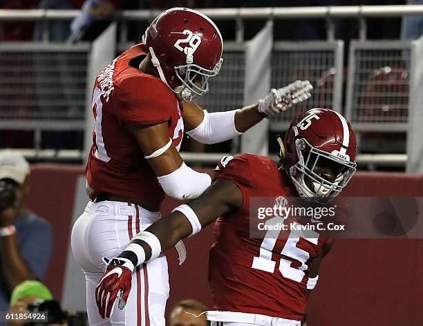 Minkah Fitzpatrick of the Alabama Crimson Tide celebrates with Ronnie Harrison after Harrison returned a fumble for a touchdown against the Kentucky...