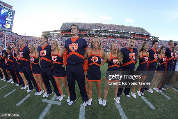 The Auburn Tigers cheerleaders sing the Alma Mater following an NCAA football game between the Auburn Tigers and the Louisiana-Monroe Warhawks at...