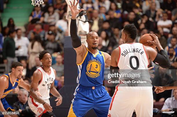 David West of the Golden State Warriors defends against Jared Sullinger of the Toronto Raptors during a preseason game on October 1, 2016 at Rogers...