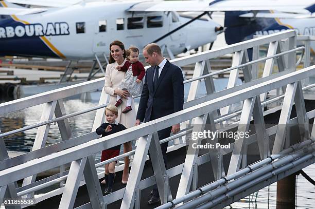 Prince William, Duke of Cambridge and Catherine, Duchess of Cambridge, Prince George and Princess Charlotte board a seaplane before departing...