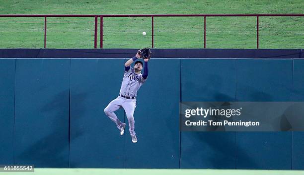 Kevin Kiermaier of the Tampa Bay Rays fields a fly ball hit by Robinson Chirinos of the Texas Rangers for the out in the bottom of the third inning...