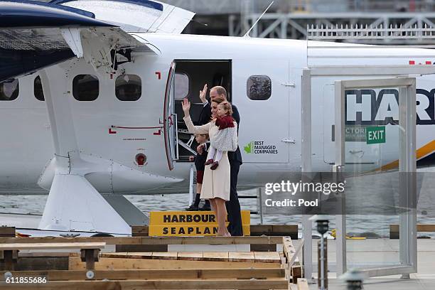 Prince William, the Duke of Cambridge and Catherine, Duchess of Cambridge, Prince George and Princess Charlotte board a seaplane before departing...