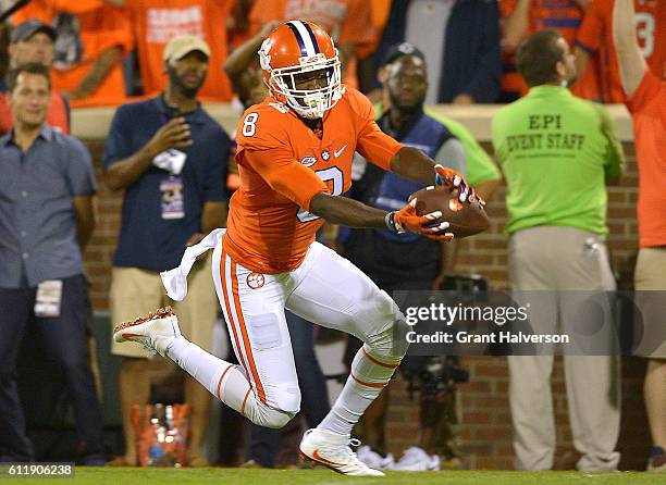 Deon Cain of the Clemson Tigers catches a second quarter touchdown reception against the Louisville Cardinals at Memorial Stadium on October 1, 2016...