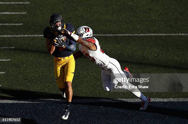 Chad Hansen of the California Golden Bears catches a touchdown in the endzone while covered by Julian Blackmon of the Utah Utes at California...