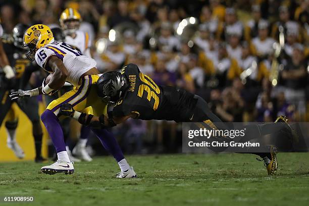 Malachi Dupre of the LSU Tigers avoids a tackle against the Missouri Tigers at Tiger Stadium on October 1, 2016 in Baton Rouge, Louisiana.