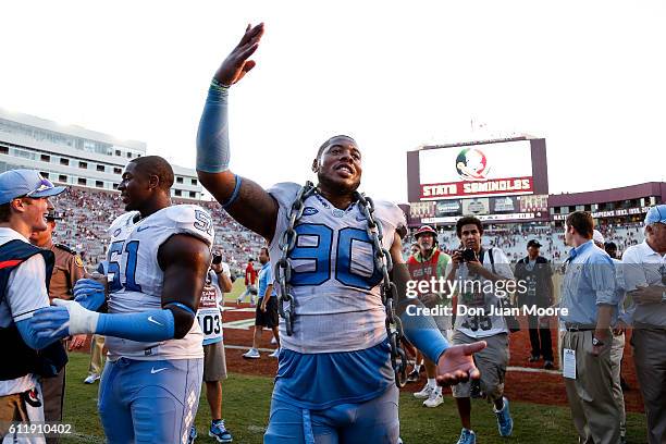 Defensive Tackle Nazair Jones of the North Carolina Tar Heels wears a chain while celebrating with teammates after the game against the Florida State...