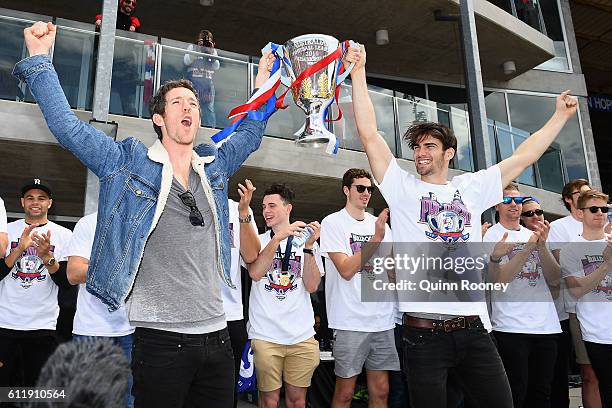 Easton Wood and Robert Murphy of the Bulldogs show the trophy to the crowd during the Western Bulldogs AFL Grand Final celebrations at Whitten Oval...