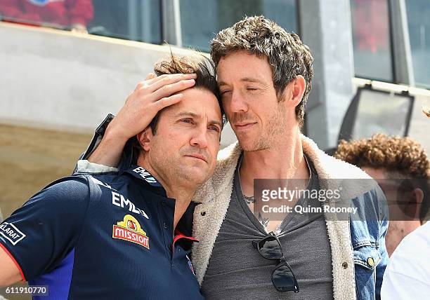Luke Beveridge and Robert Murphy of the Bulldogs embrace during the Western Bulldogs AFL Grand Final celebrations at Whitten Oval on October 2, 2016...