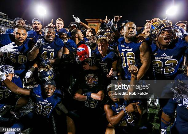 Panthers players celebrate after the game against the Florida Atlantic Owls at FIU Stadium on October 1, 2016 in Miami, Florida.