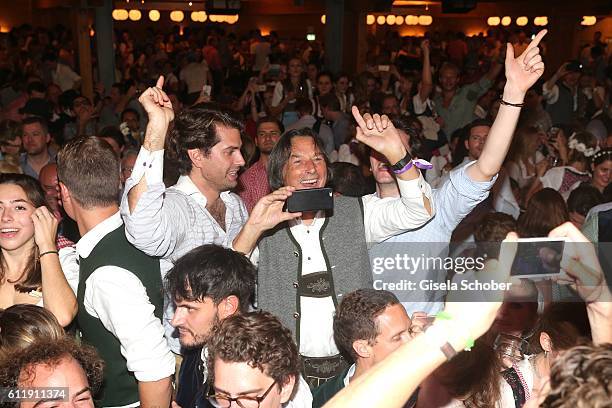 Dr. Hans-Wilhelm Mueller-Wohlfahrt photographs during the Oktoberfest at Schuetzen-Festzelt /Theresienwiese on October 1, 2016 in Munich, Germany.