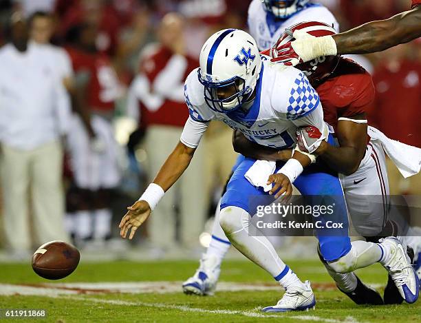 Tim Williams of the Alabama Crimson Tide strips the ball and forces a fumble by Stephen Johnson of the Kentucky Wildcats at Bryant-Denny Stadium on...
