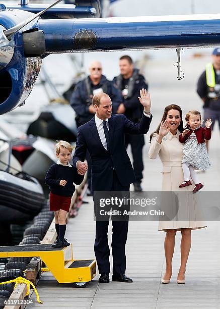 Prince George of Cambridge, Prince William, Duke of Cambridge, Catherine, Duchess of Cambridge and Princess Charlotte wave as they leave from...