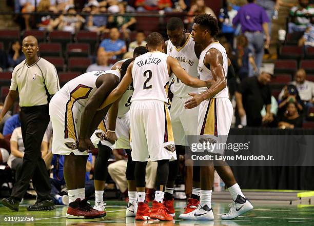 The New Orleans Pelicans hbuddle during the game against the Dallas Mavericks during a preseason game on October 1, 2016 at CenturyLink Center in...