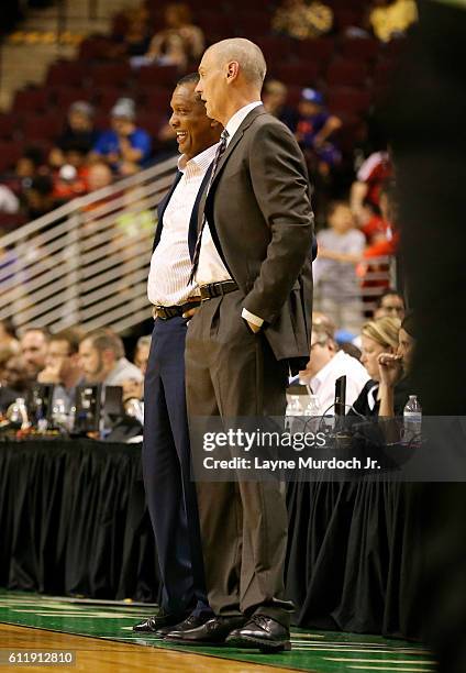 Head Coach Rick Carlisle of the Dallas Mavericks talks with Head Coach Alvin Gentry of the New Orleans Pelicans during a preseason game on October 1,...