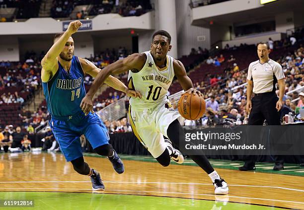 Langston Galloway of the New Orleans Pelicans drives to the basket against Keith Hornsby of the Dallas Mavericks during a preseason game on October...