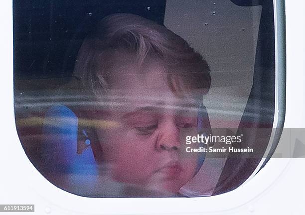 Prince George of Cambridge looks out of the window of a sea plane as he departs Victoria on October 1, 2016 in Victoria, Canada.