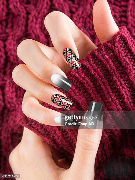 close-up of a women's hand with design on fingernails - heart nail art stock pictures, royalty-free photos & images