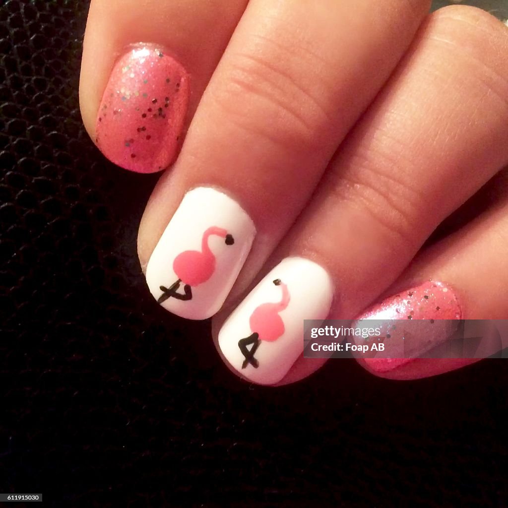 Close-up of fingernail showing Flamingo Nail Art
