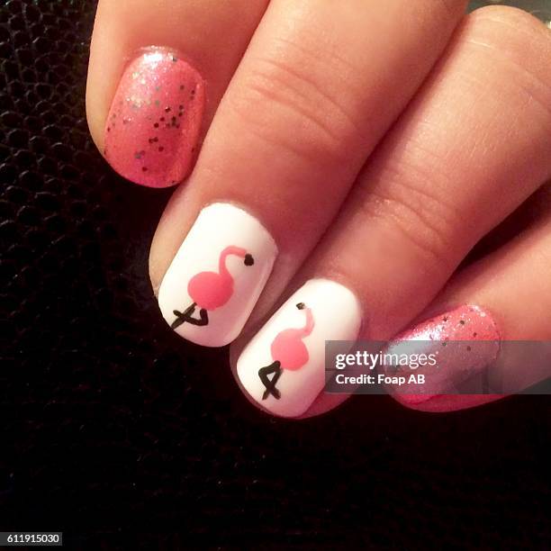 Close-up of fingernail showing Flamingo Nail Art