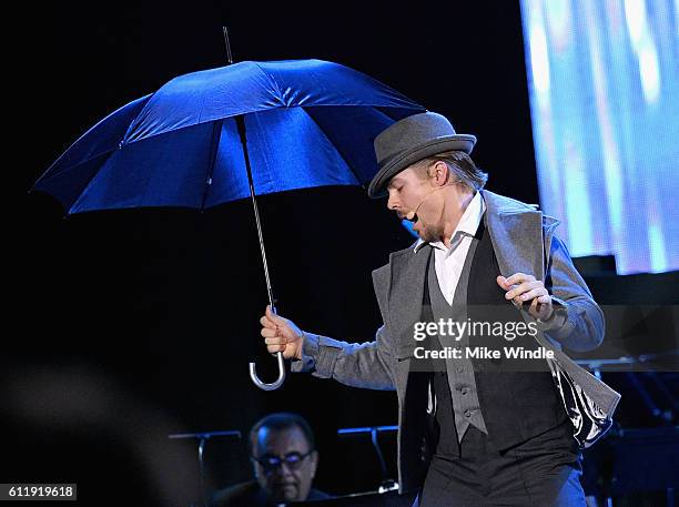 Dancer/TV personality Derek Hough performs onstage during the MPTF 95th anniversary celebration with "Hollywood's Night Under The Stars" at MPTF...