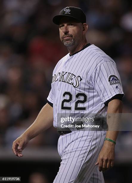 Walt Weiss of the Colorado Rockies walks to the dugout after a pitching change in the eighth inning against the Milwaukee Brewers at Coors Field on...