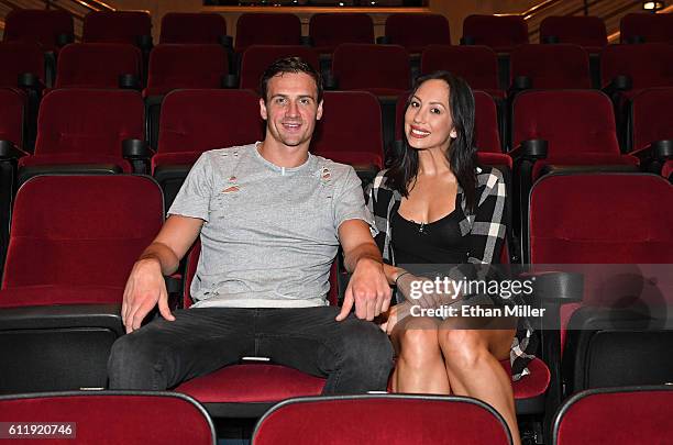 Olympian Ryan Lochte and dancer Cheryl Burke pose after watching a private performance of "O by Cirque du Soleil" during a rehearsal for their...